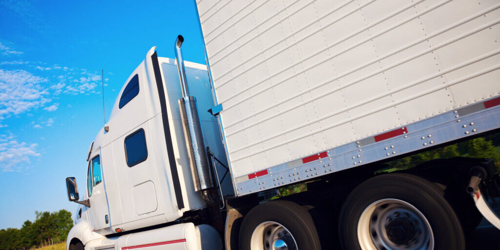 white truck moving on the road